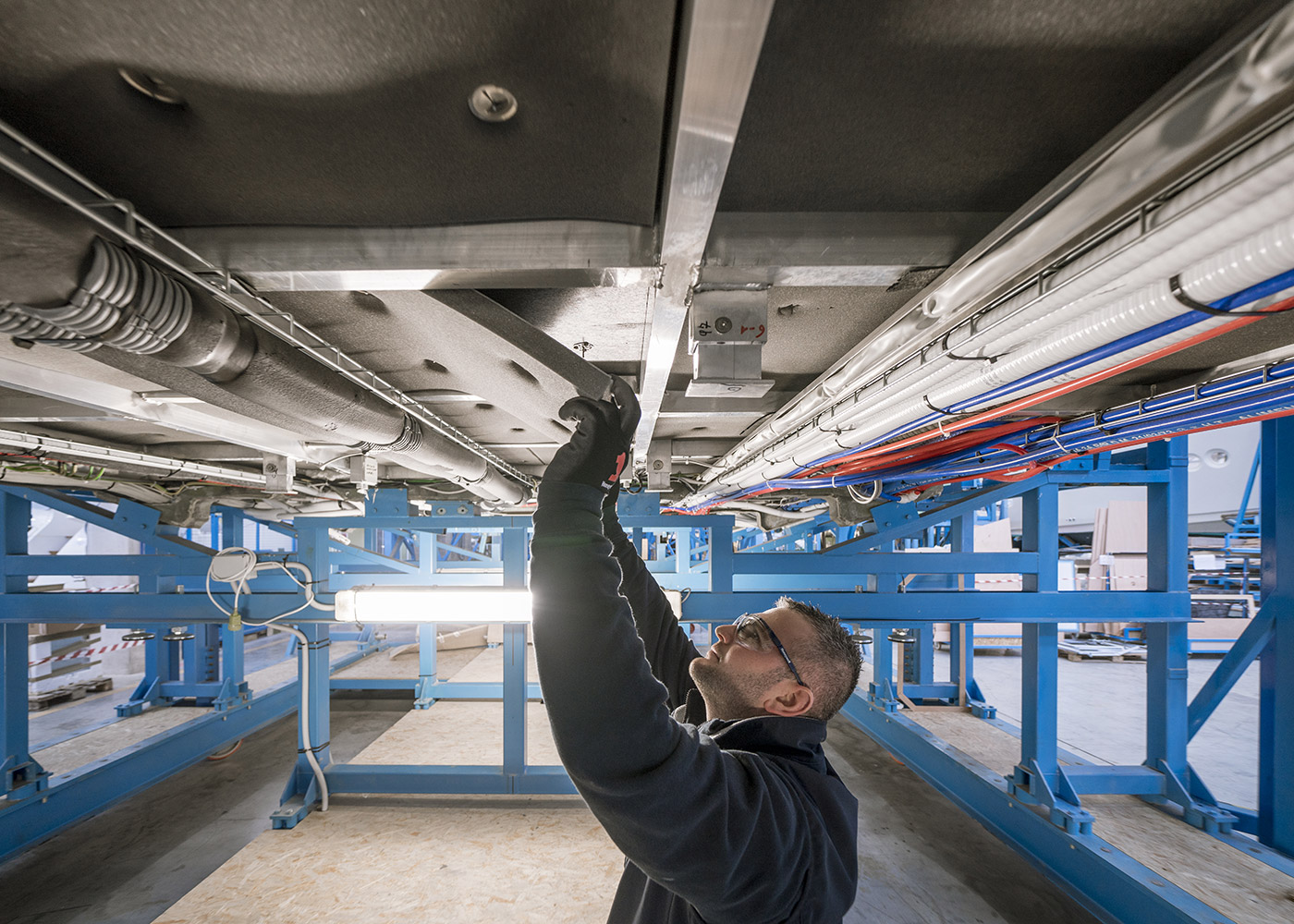 MCY worker installing composite insulation materials.